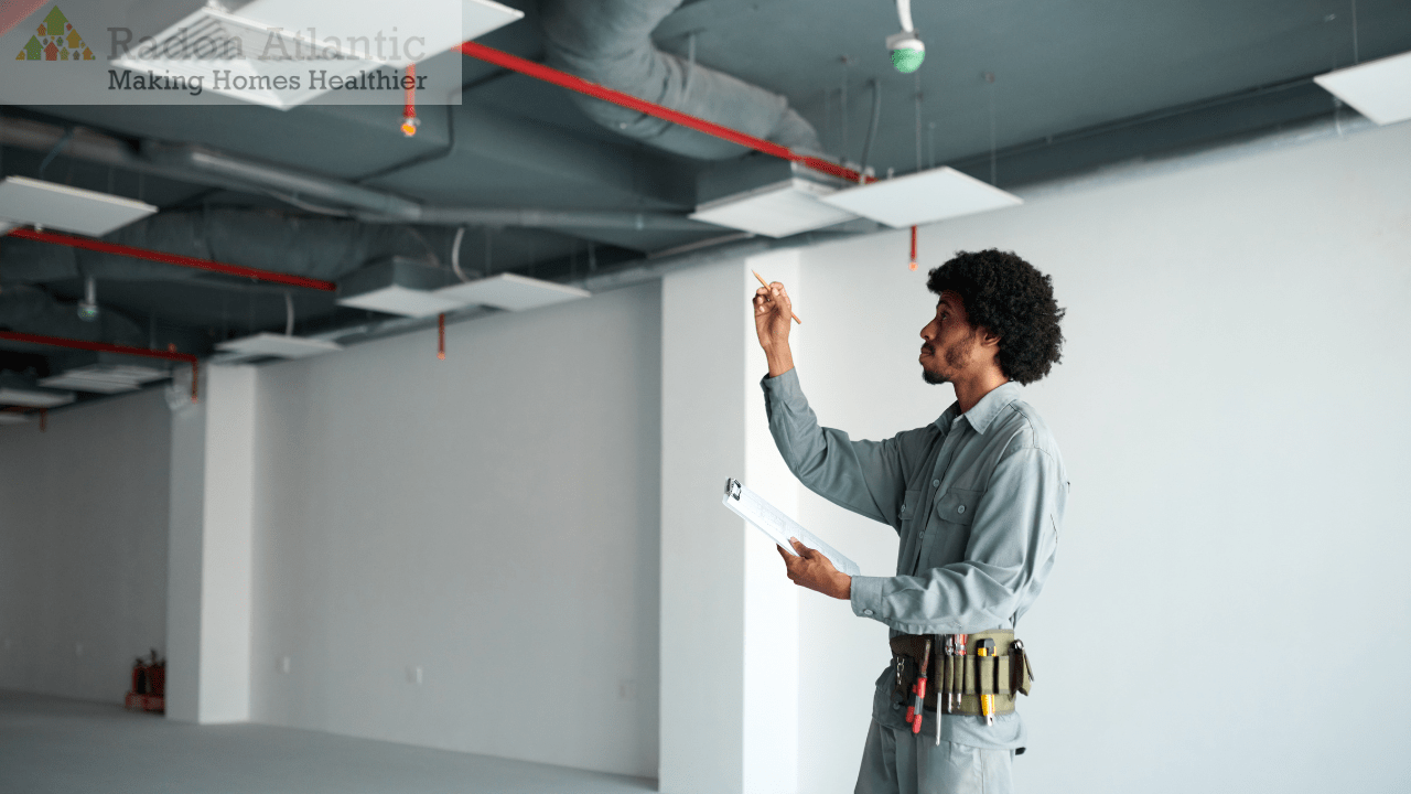 Technician reviewing residential ventilation system design